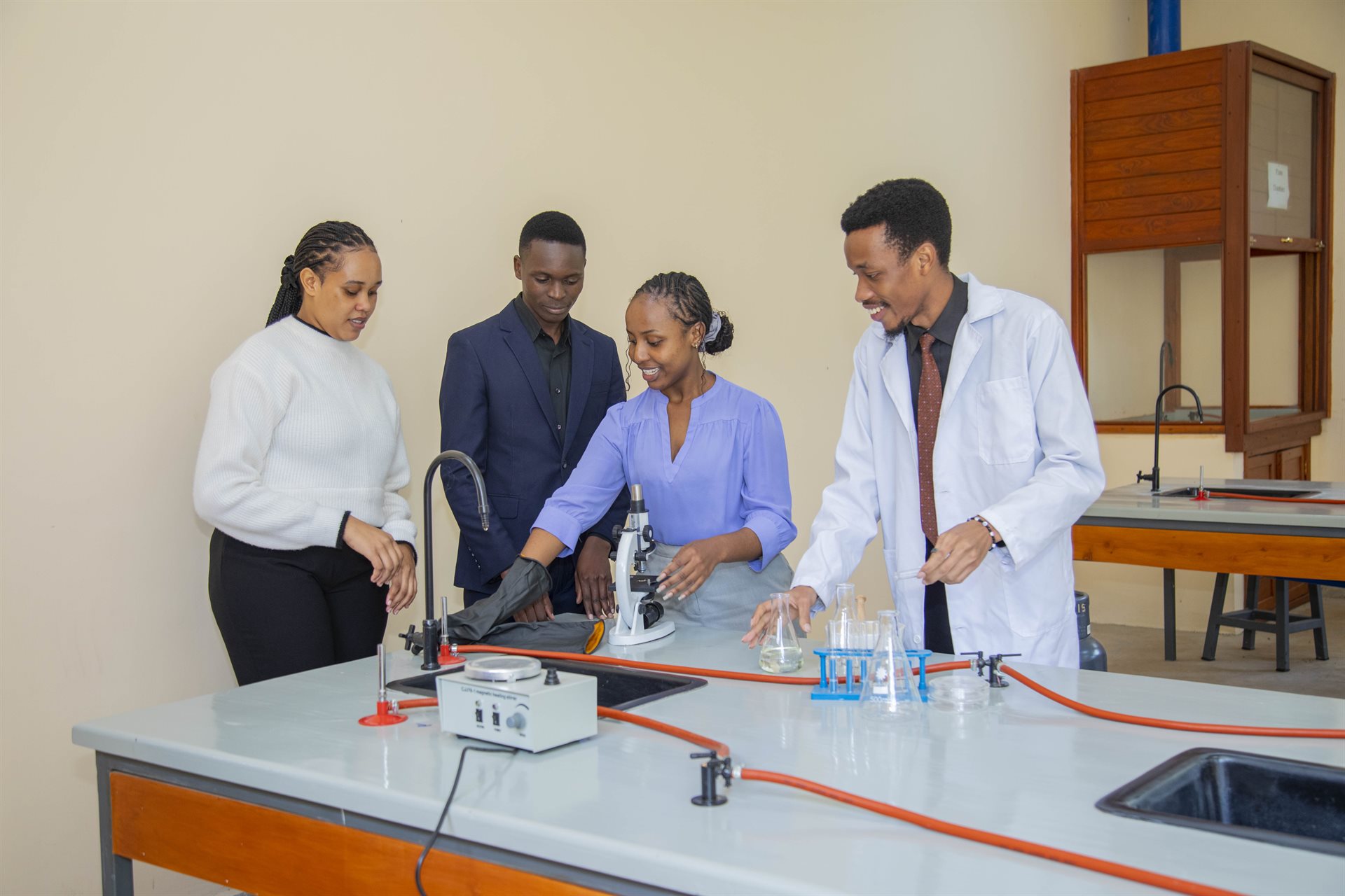 TUMA students working in a science laboratory